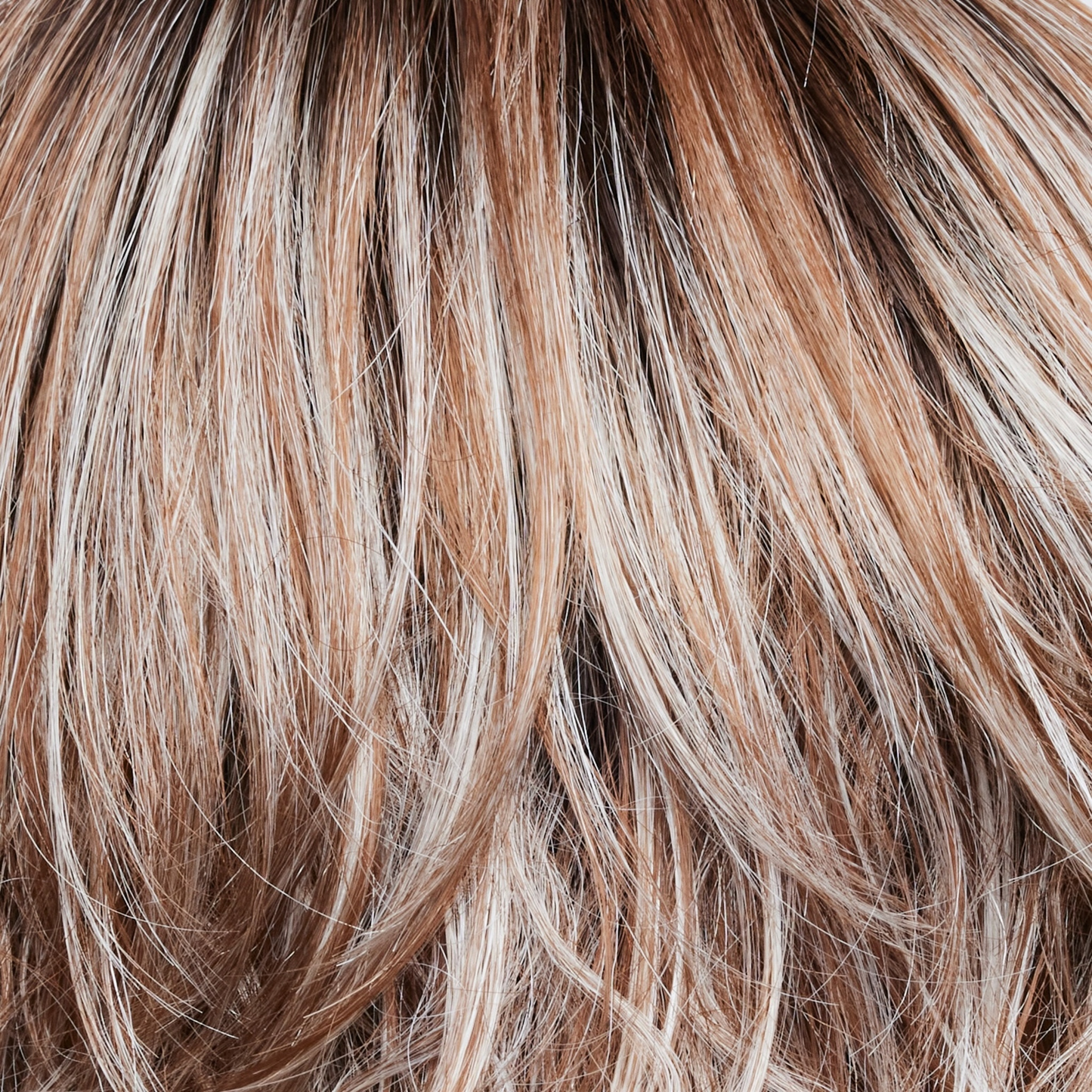 NM Melted Cinnamon - A medium-brown root tone that melts into the cinnamon blond base color. It's then topped off with icy blond ends.